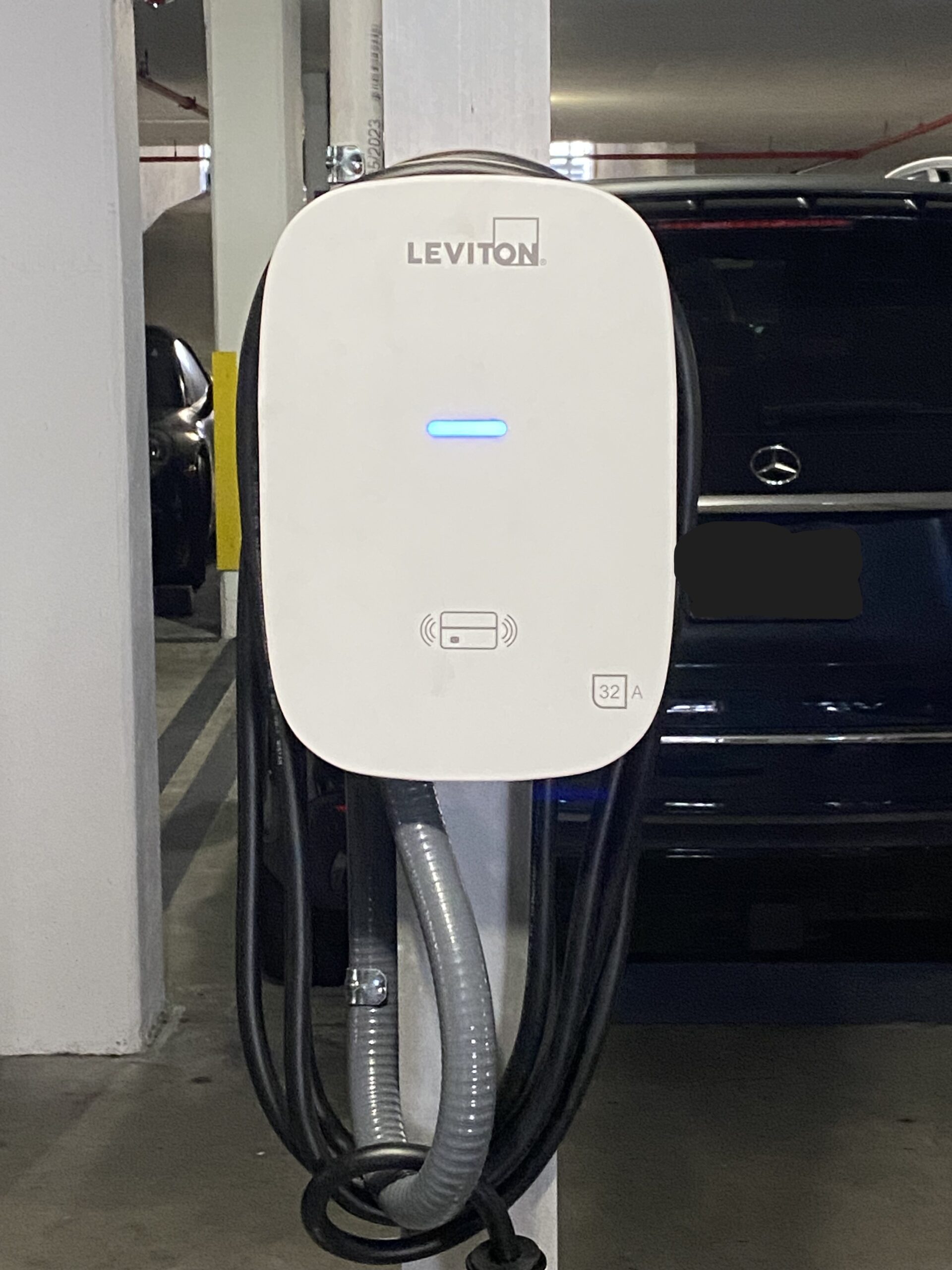 Leviton Level 2 EV charger installed in a South Florida condominium parking garage